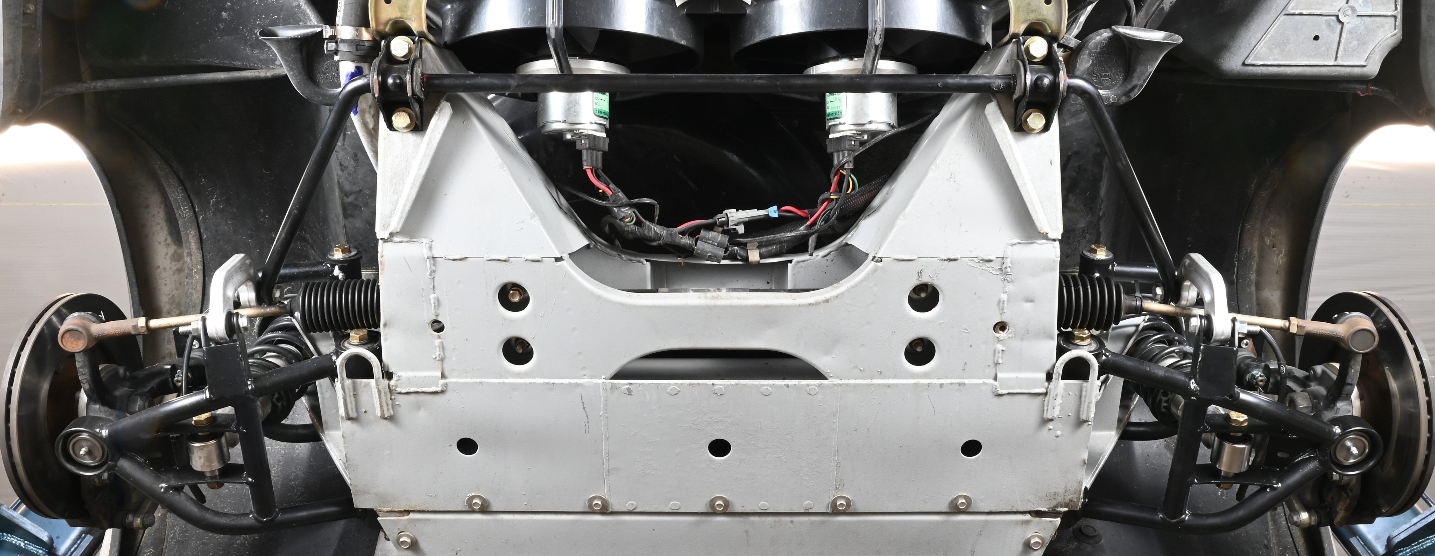 DeLorean tubular lower control arm assembly showcasing the SICArm LCA upgrade for enhanced vehicle performance.